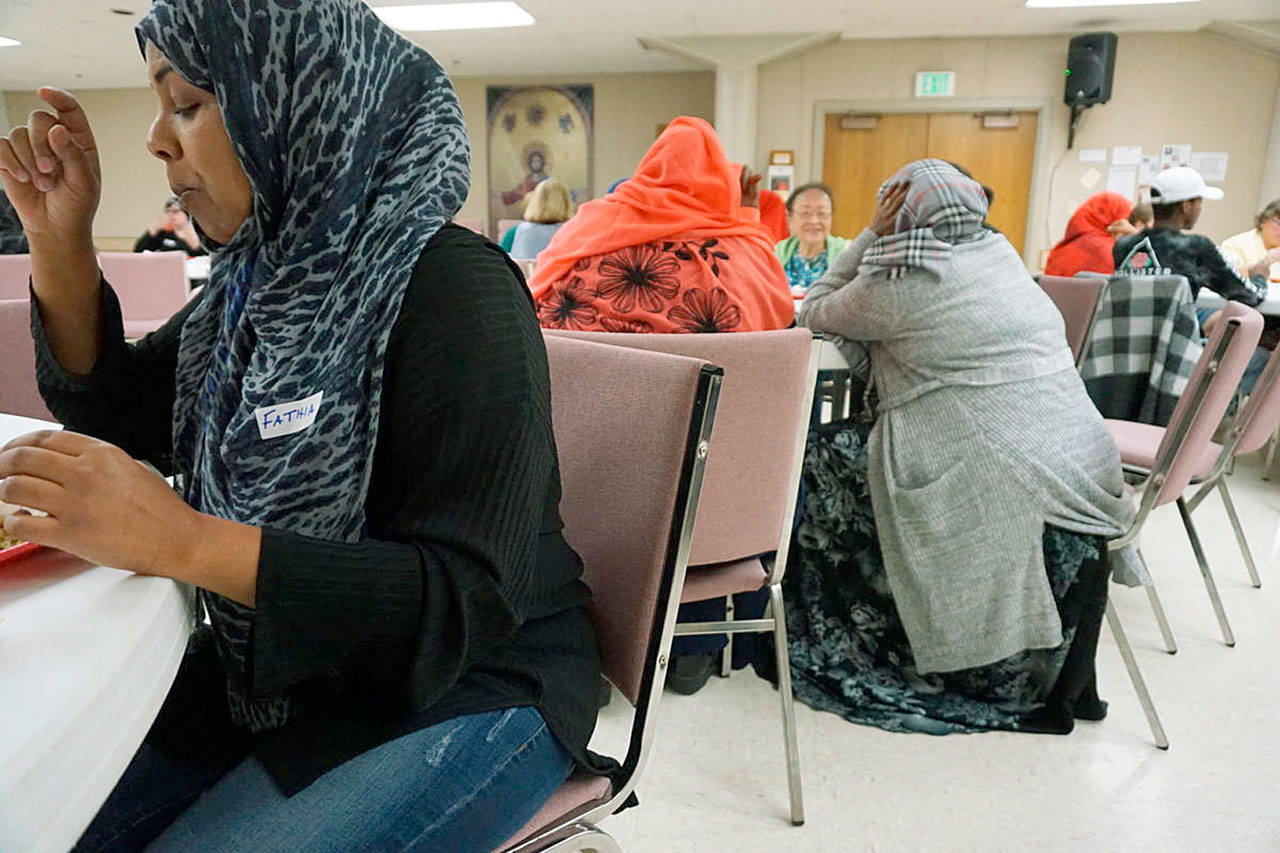 Attendees dig in at an Eat With Muslims dinner last Friday at Kent’s St. James Episcopal Church. DANIEL PERSON, Seattle Weekly