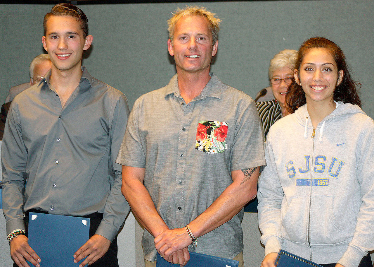 The city of Kent honors Lake Meridian Park lifeguards Hunter Wruth, Shawn Wruth and Genevieve Tipton at the Sept. 19 City Council meeting. STEVE HUNTER/Kent Reporter