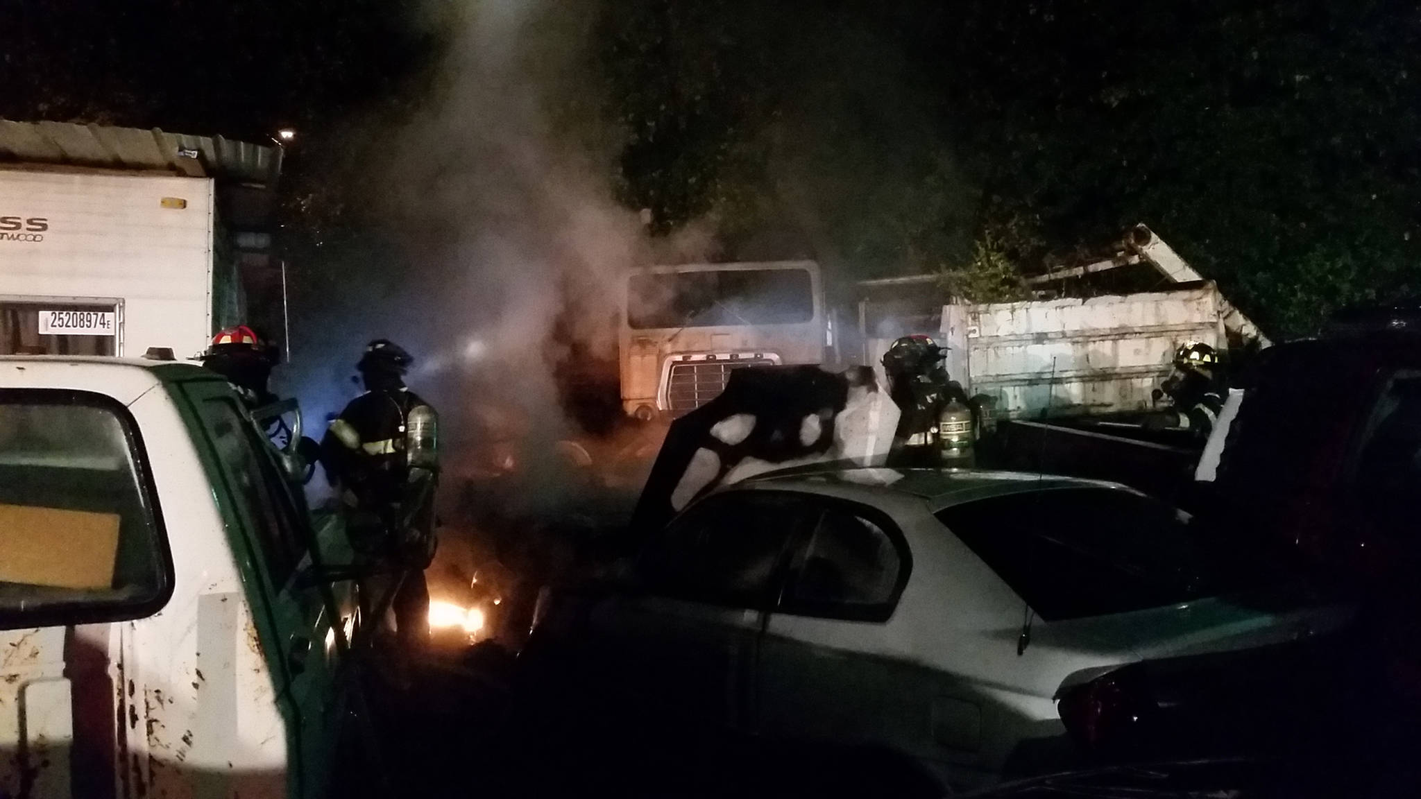 Despite difficulty in getting to the middle of the car lot, Puget Sound Fire crews were able to quickly put water on the five vehicles that were burning early Saturday morning. COURTESY PHOTO, Puget Sound Regional Fire Authority