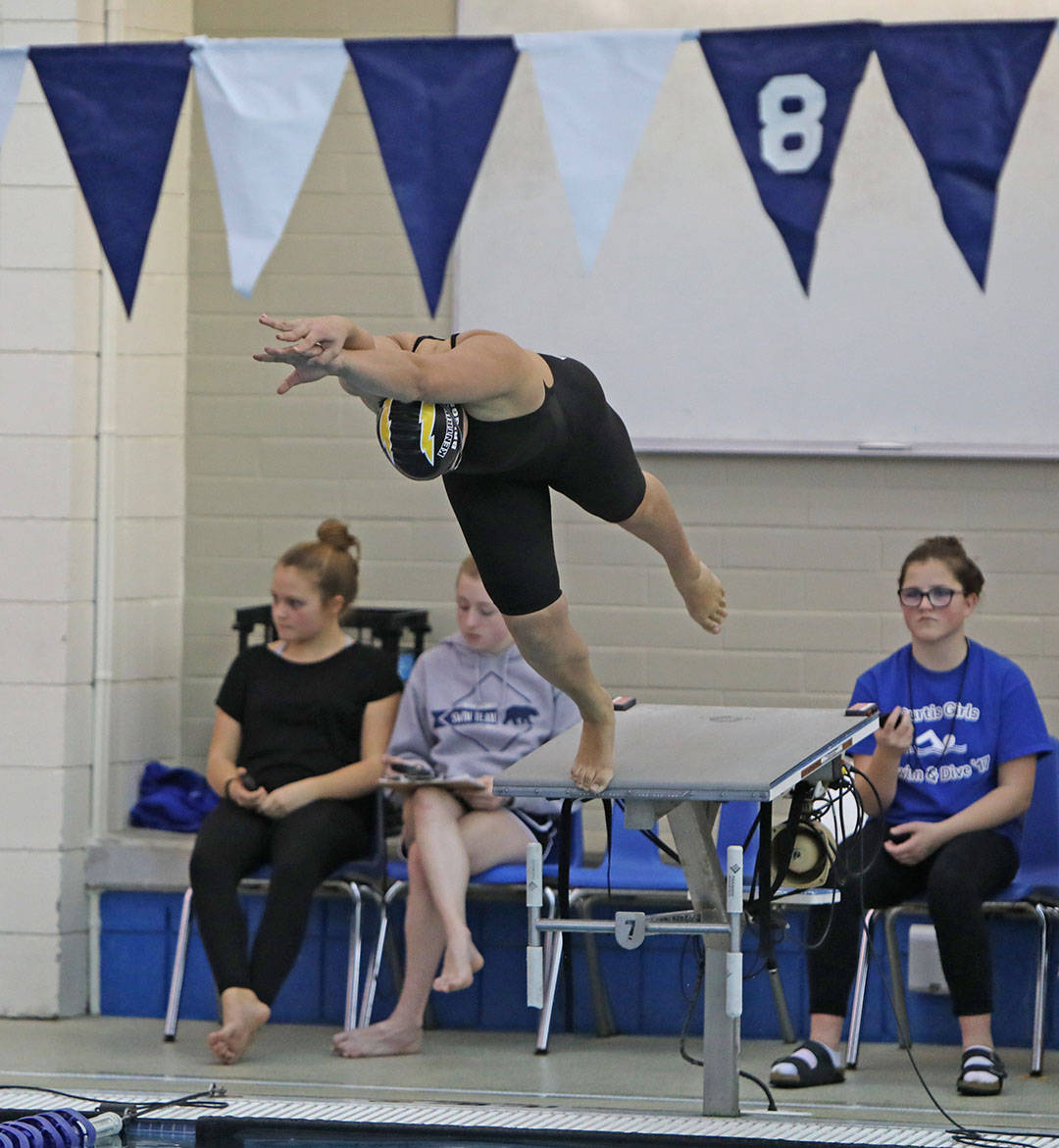 Kentridge&rsquo;s Lauren Briggs, above, explodes at the start of her 100-yard freestyle event during the 4A West Central Districts Girls Swim Dive at the Curtis High School Aquatic Center in University Place last Saturday. COURTESY PHOTO, Tracy Arnold