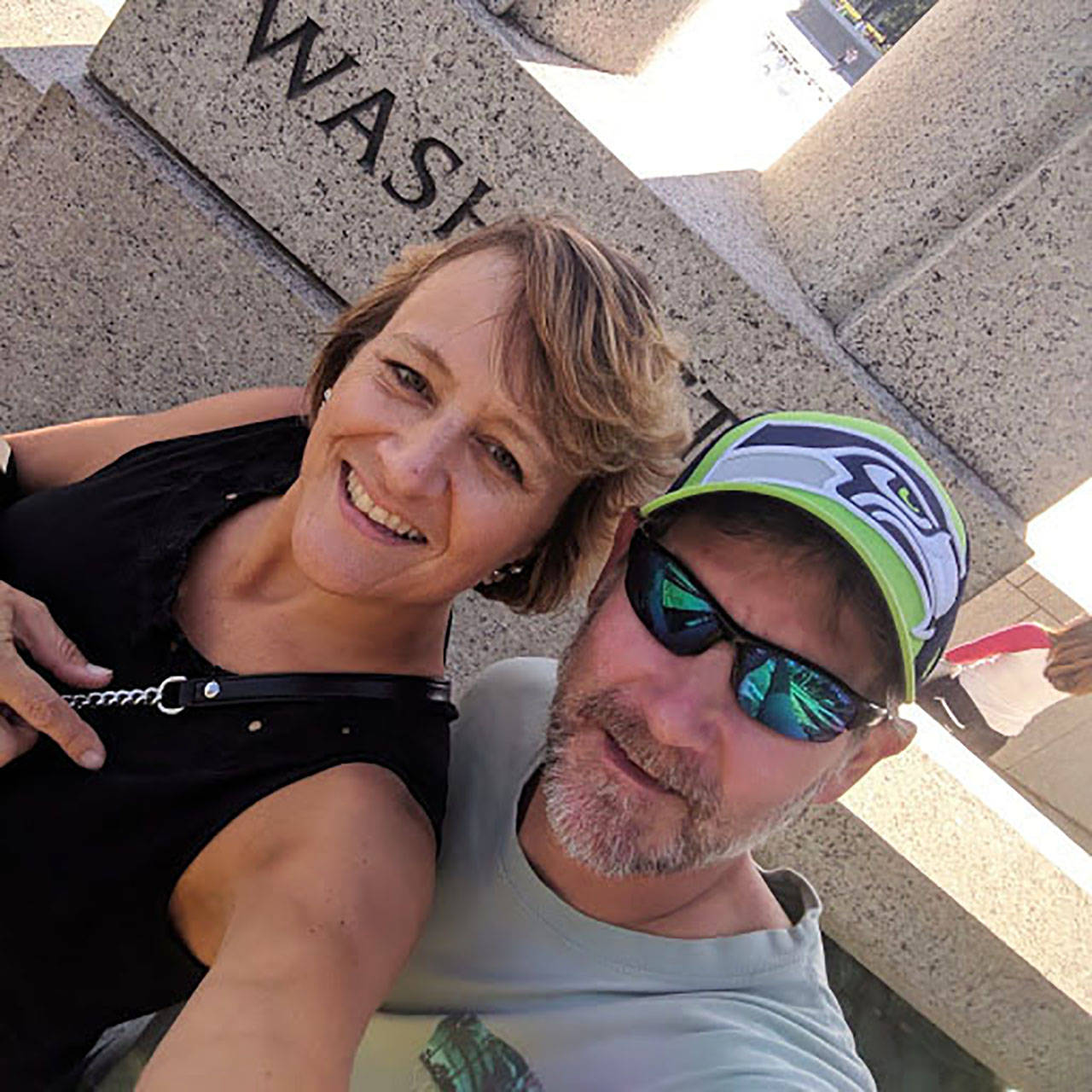Michael-Ann McAboy and her husband, Mike, in front of the Washington state statue at the World War II Memorial during their September trip to Washington, D.C. COURTESY PHOTO