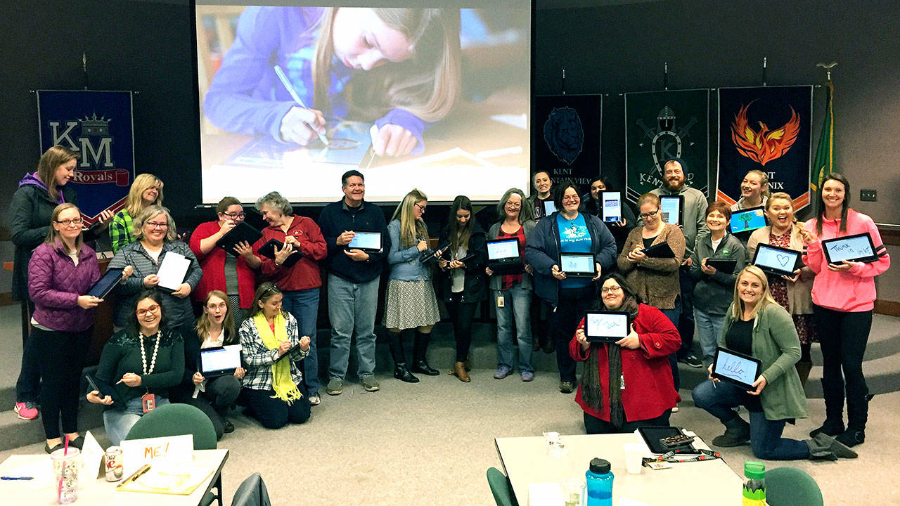Digital (th)Inking Institute participants work to understand the importance of digital inking in classroom instruction and to explore resources that come built in to the new devices for literacy, math, science and research. COURTESY PHOTO, Kent School District
