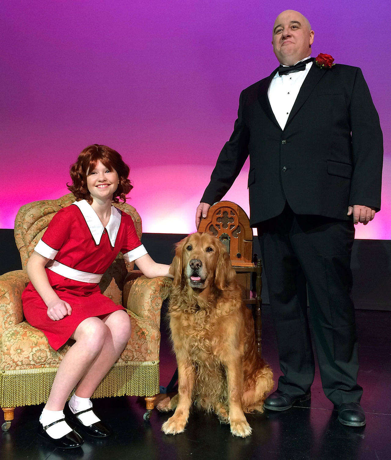 Annika Jancola as Annie, Copper Eby as Sandy and Patrick Roduin as Oliver Warbucks in Heavier Than Air Family Theatre Company’s upcoming production of “Annie.” COURTESY PHOTO