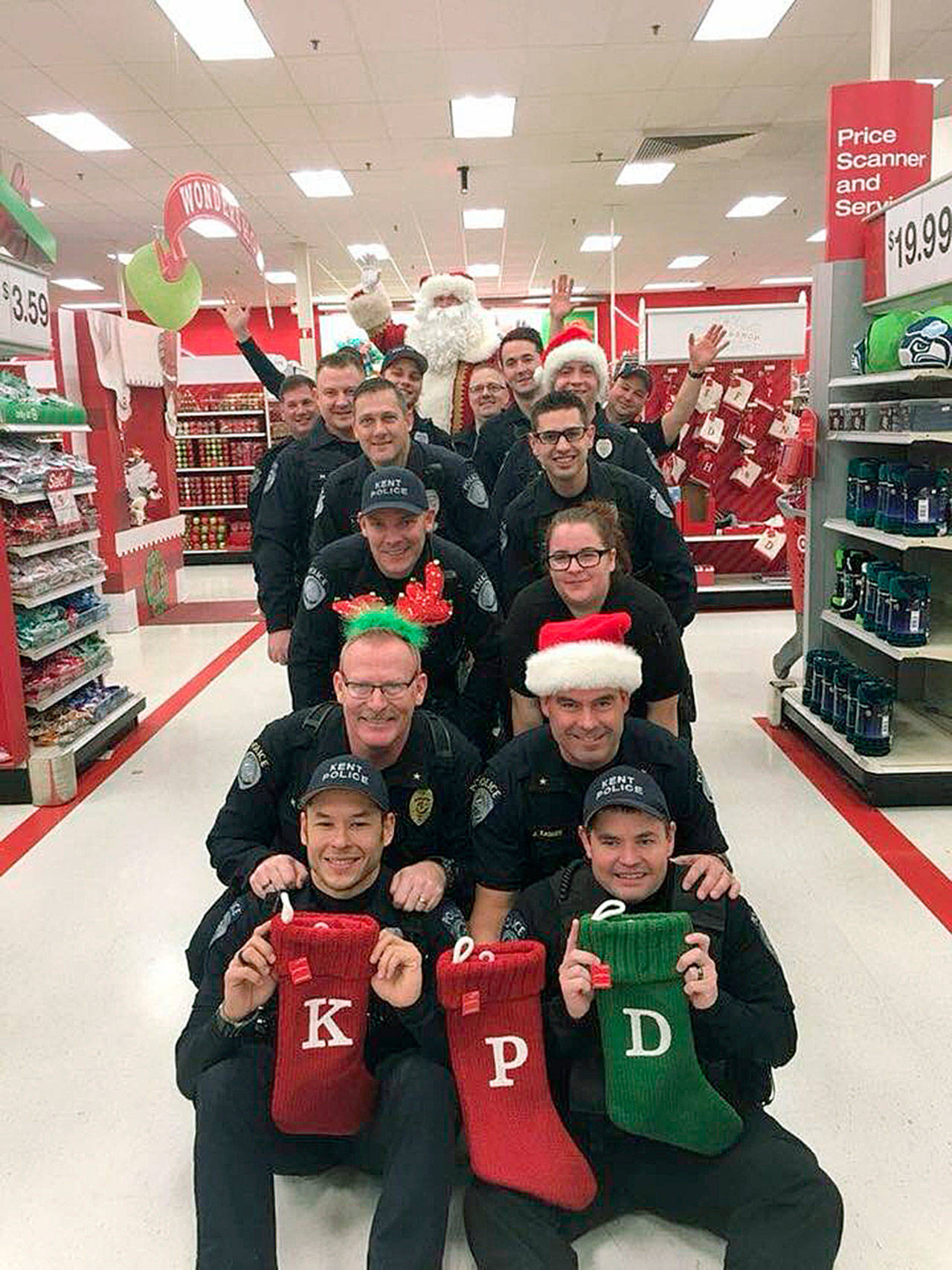 Kent Police officers and staff participated in Target’s Heroes & Helpers program on Saturday to help children purchase gifts for their families. COURTESY PHOTO, Kent Police