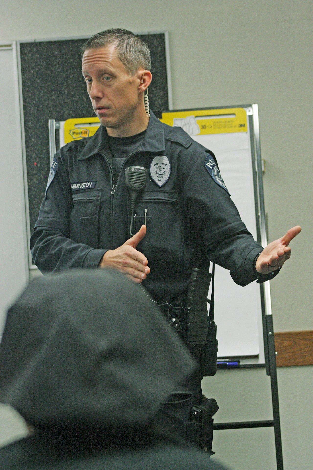 Kent Police Officer Ian Warmington describes what it’s like to be a cop during a Game of Life Youth Conference workshop at Kent Commons on Monday. MARK KLAAS, Kent Reporter