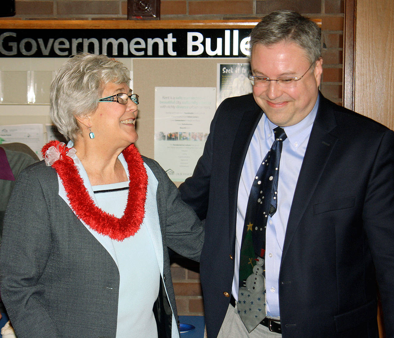 Mayor Suzette Cooke shares a laugh with city Chief Administrative Officer Derek Mathesen during a reception at City Hall on Tuesday. STEVE HUNTER, Kent Reporter
