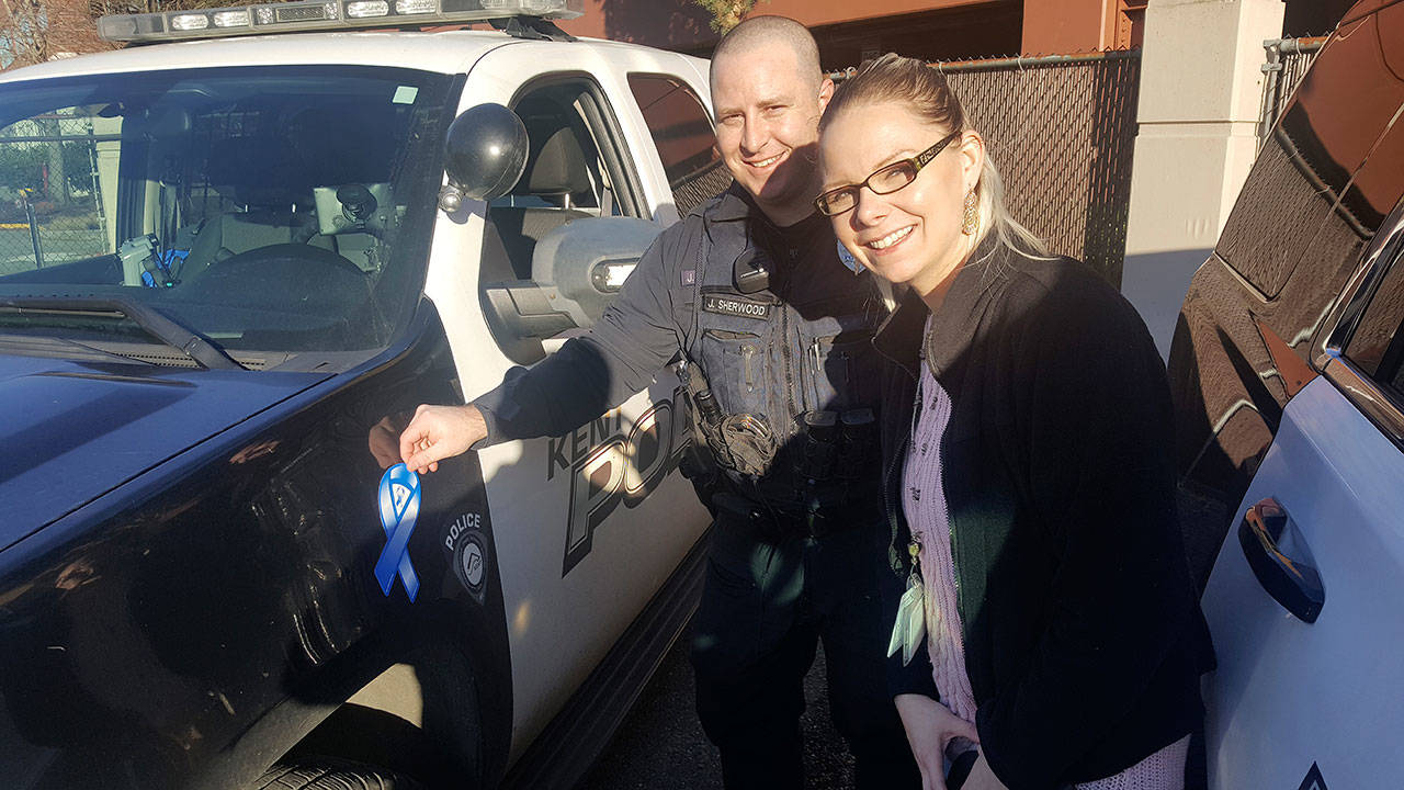 Kyra Doubek, a CSEC (commercially sexual exploitation of children) behavioral health specialist with Kent Youth and Family Services, works with Kent Police as a victims’ advocate. With Doubek is Officer James Sherwood. COURTESY PHOTO