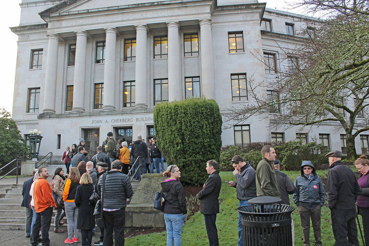 People wait to get into a hearing at the Capitol on proposed gun bill legislation Monday. Photo by Taylor McAvoy