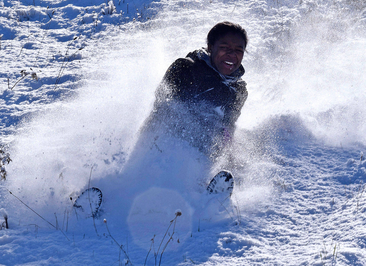 Roslyn Fagan slides down a snowy hillside in Auburn on Thursday. RACHEL CIAMPI, Auburn Reporter