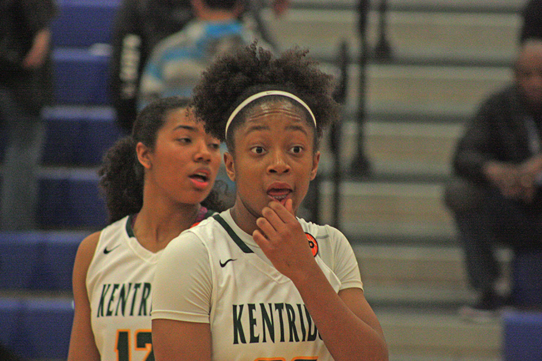 Kentridge sophomore Dayla Ballena, right, looks to the bench for instruction during a 4A regional basketball playoff against Bellarmine Prep on Saturday. Ballena scored a career-high 19 points and her backcourt teammate, senior Tresai McCarver, left, had nine points in the win. MARK KLAAS, Kent Reporter