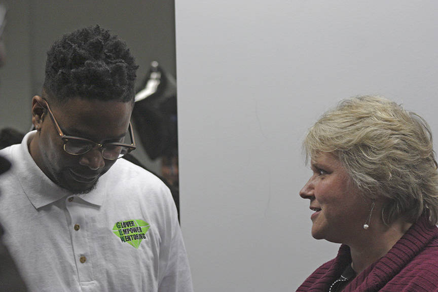 Kendrick Glover, GEM co-founder and executive director, shares a moment with Mayor Dana Ralph during the nonprofit’s grand opening of its new home Feb. 28. MARK KLAAS, Kent Reporter