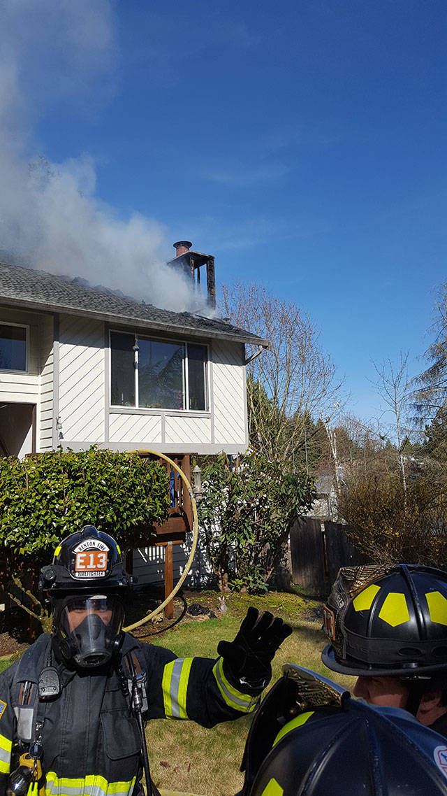 Firefighters put out a house fire that started in the chimney box and extended into the attic on Kents East Hill late Monday morning. COURTESY PHOTO, Puget Sound RFA
