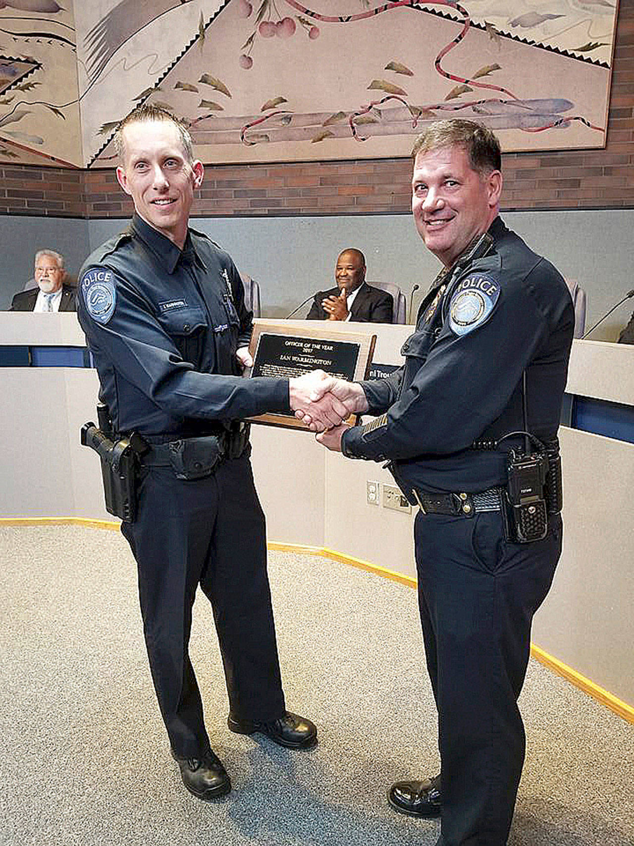 Ian Warmington, left, receives the Kent Police 2017 Officer of the Year award from Chief Ken Thomas at the March 20 City Council meeting. COURTESY PHOTO, Kent Police