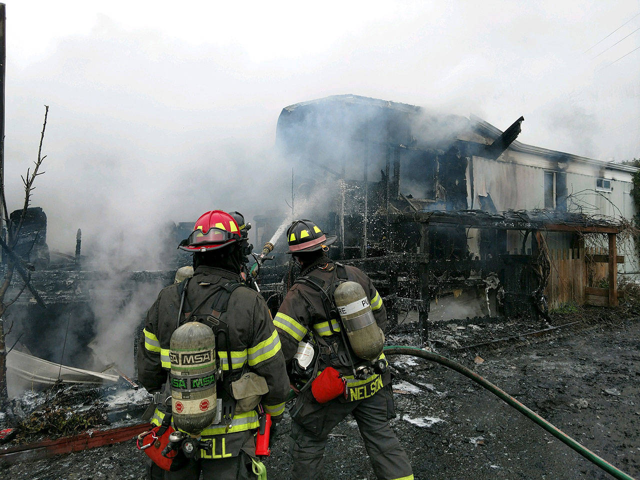 Firefighters respond Tuesday afternoon to a SeaTac mobile home fire. COURTESY PHOTO, Puget Sound Fire