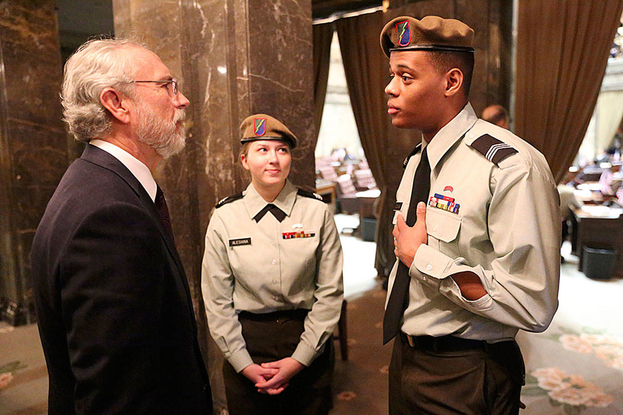 Cadet graduate Damenique Duncan of Federal Way tells his story to Congressman Dan Newhouse in Olympia this past January, accompanied by fellow cadet graduate Daria Aleshina of Bremerton. COURTESY PHOTO, Washington Youth Academy