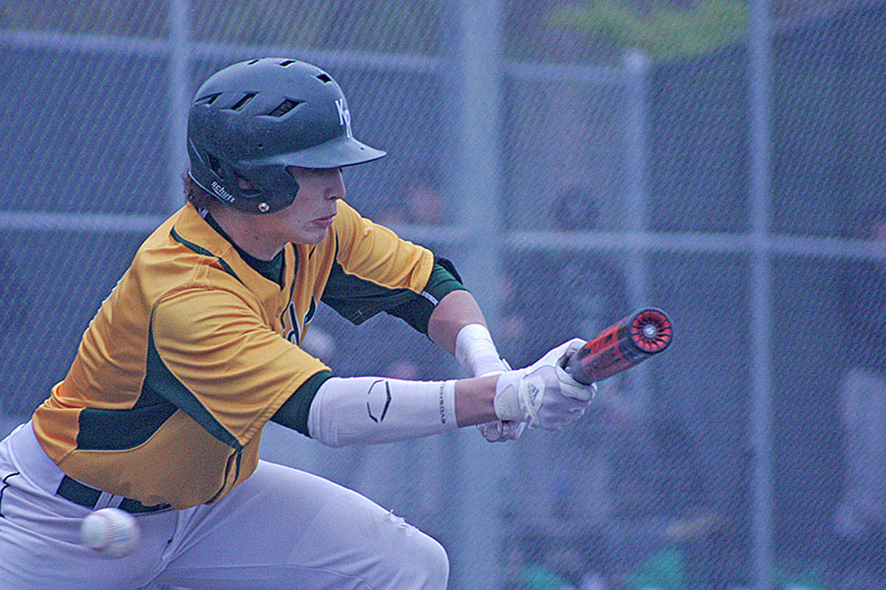 Kentridge’s Louie Albrecht tries to square up to bunt as a pitch falls outside the strike zone during NPSL play against Kentwood last week at Hogan Park. MARK KLAAS, Kent Reporter