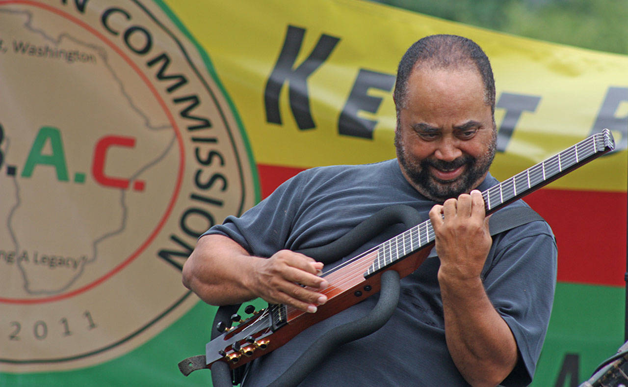 Jazz guitarist Michael Powers jams during his concert in the park at the KBAC Juneteenth celebration last year. MARK KLAAS, Kent Reporter