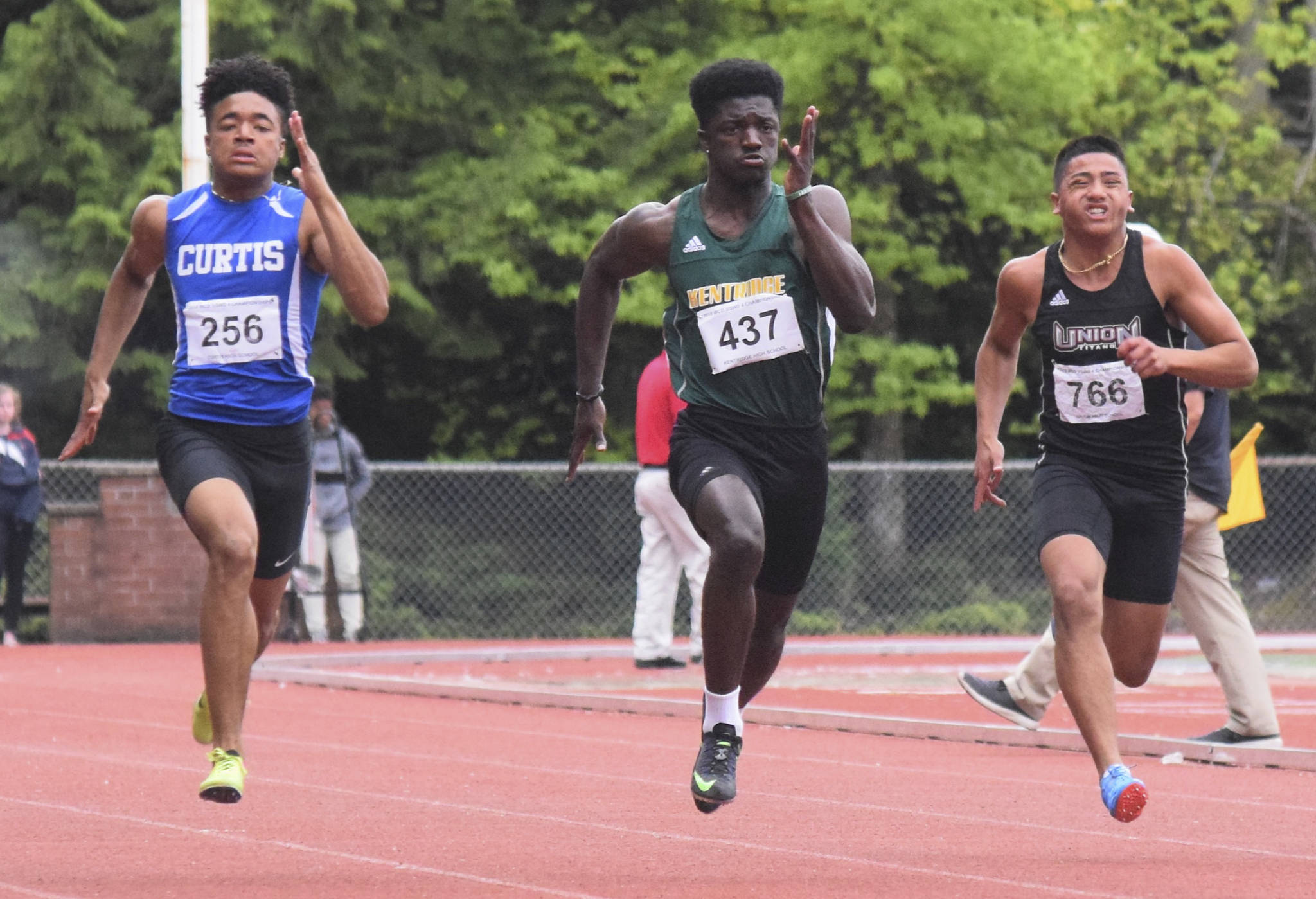 Kentridge’s Solomon Hines, middle, dashes to a second-place finish in the 100-meter district final in 10.82 seconds. RACHEL CIAMPI, Reporter