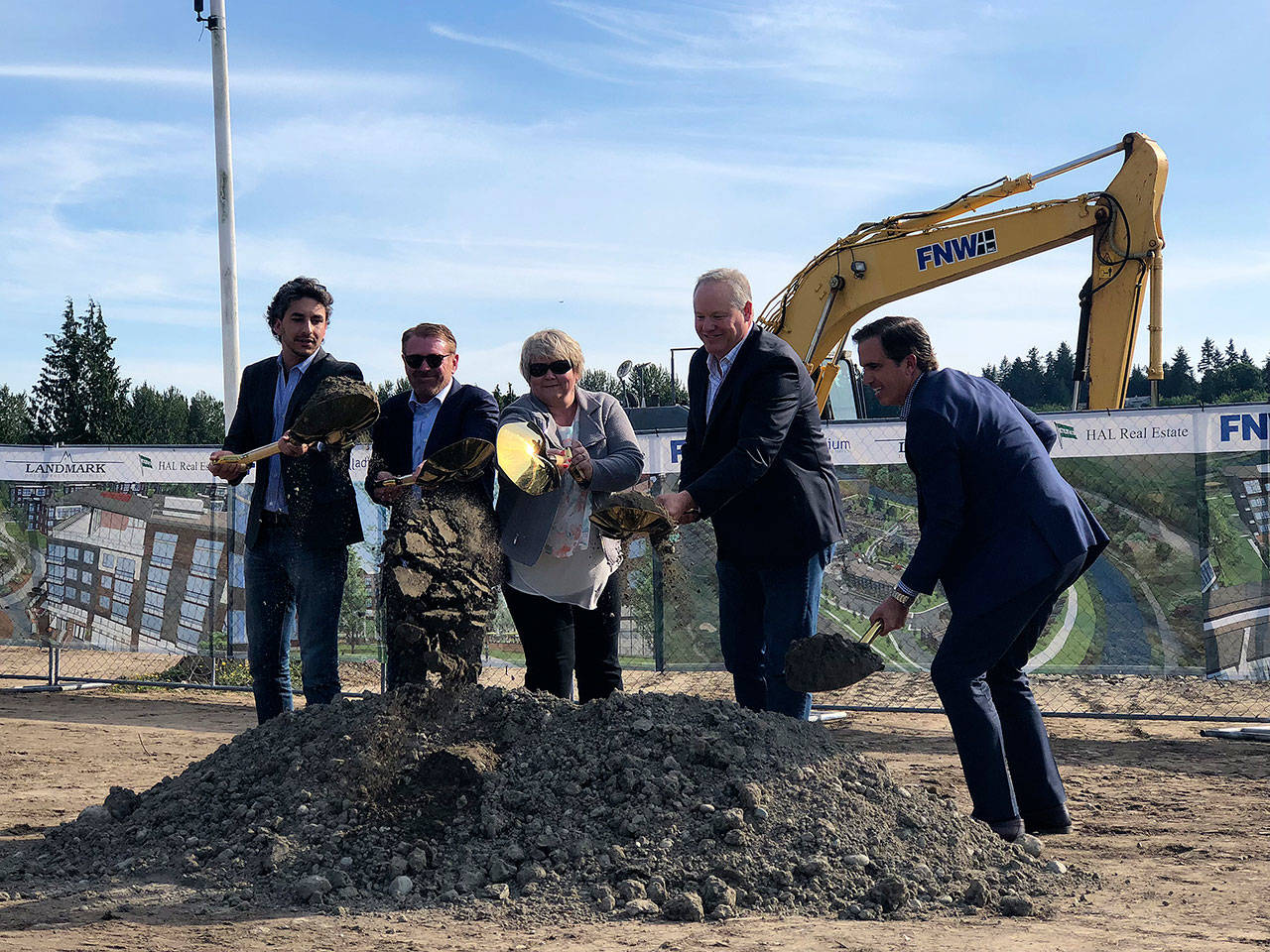 Developers Jonathan Manheim, far left, John McKenna, Brett Jacobsen and Charles Strazzara join Kent Mayor Dana Ralph, center, to break ground Thursday, May 24, on the Marquee on Meeker mixed-use project on the former par 3 golf course property. COURTESY PHOTO