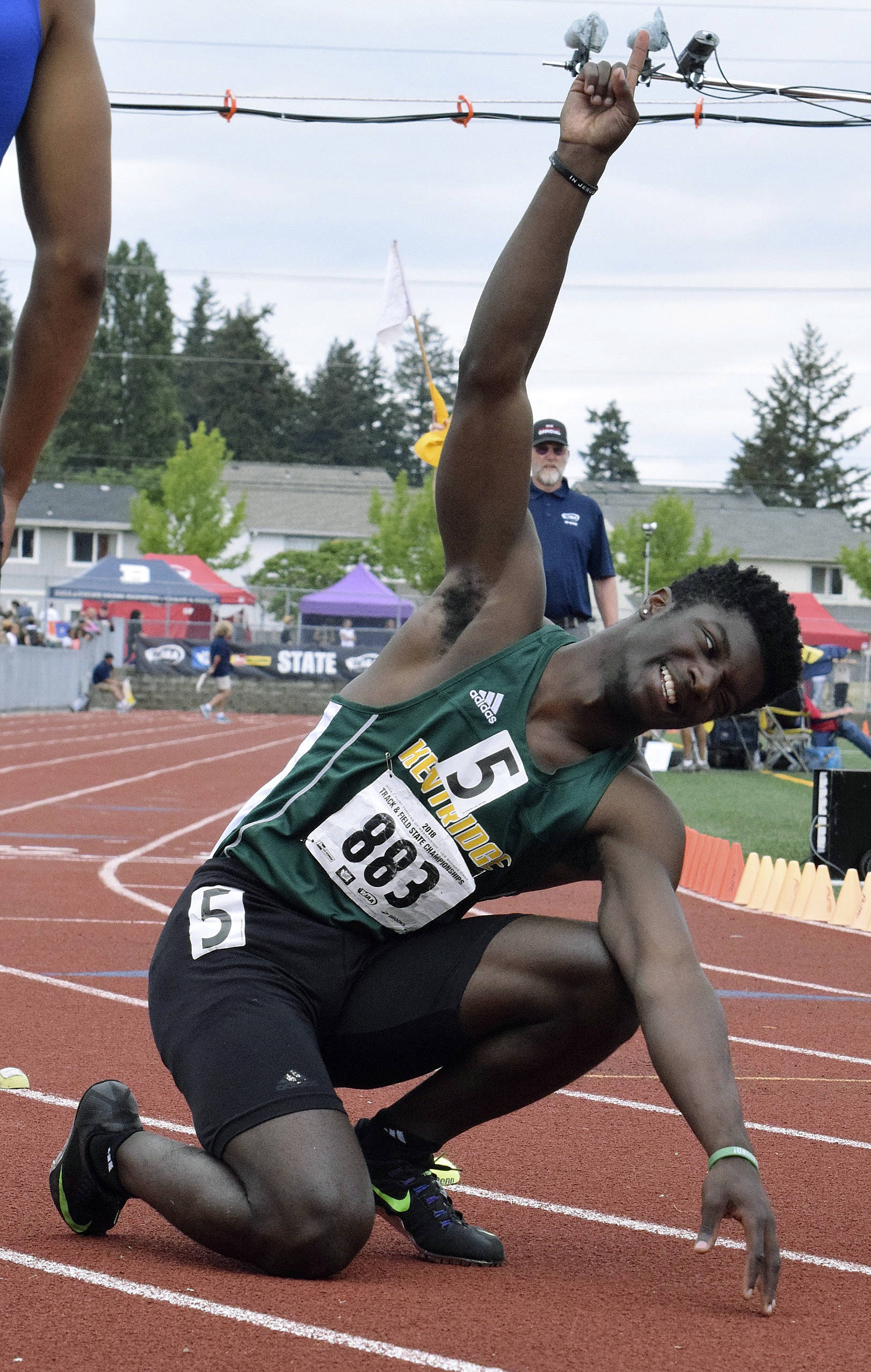 Kentridge’s Solomon Hines points to the sky and after winning the 200-meter dash at the 4A state track and field finals at Mount Tahoma High School in Tacoma last Saturday. RACHEL CIAMPI, Reporter
