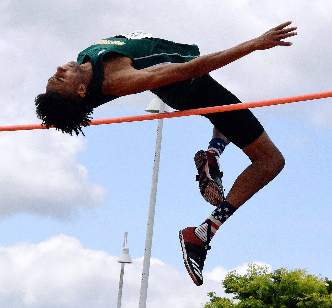 Kentridge’s Tyler Cronk sails over the bar during the high jump finals at the 4A state track and field championships at Tacoma’s Mount Tahoma High School last Saturday. Cronk, a 6-foot-8 senior, cleared 6 feet, 9 inches, to capture his second straight title. RACHEL CIAMPI, Reporter