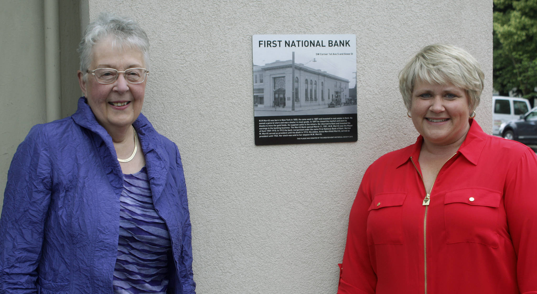Nancy Simpson, of the Greater Kent Historical Society and the city’s Landmarks Commissioner, left, meets up with Mayor Dana Ralph, at the corner of 1st Avenue South and Gowe Street, where the building was once the First National Bank. Historical plaques describing 13 downtown Kent sites were unveiled last Friday. MARK KLAAS, Kent Reporter