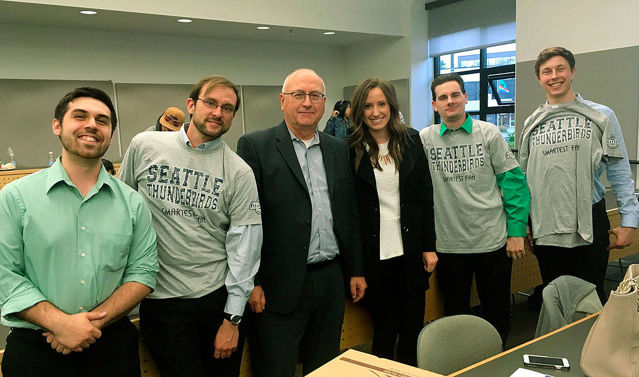 Green River College students worked closely with the Seattle Thunderbirds and Russ Farwell, the team’s vice president of hockey operations, third from left, to design and develop the World’s Smartest T-Bird Fan App. The students who led the project are, from left, Nathan Strand, Jonn McCoy, Erin Saunders, Timothy Roush and Caleb Ostrander. COURTESY PHOTO