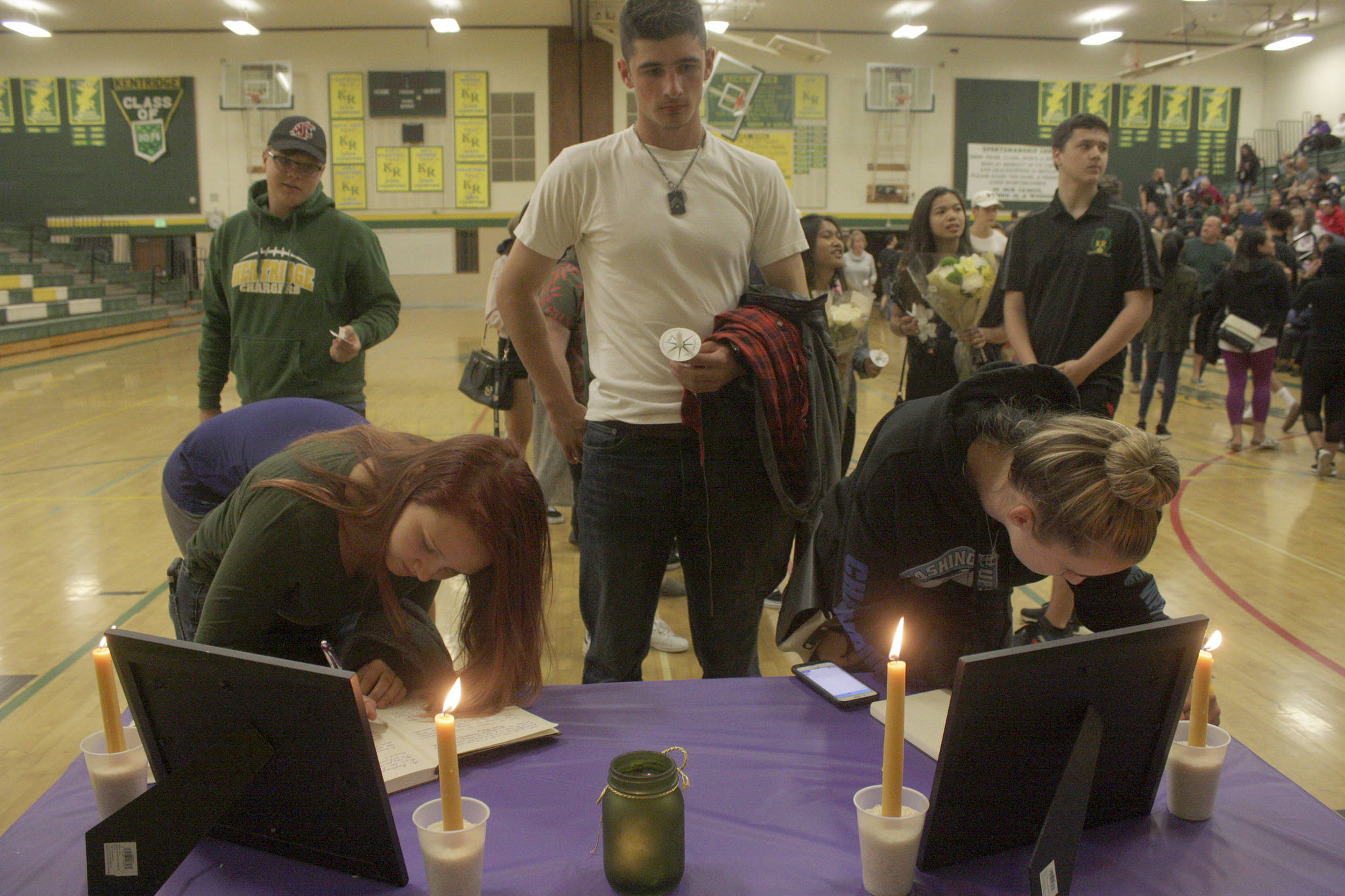 Students and supporters line up in the gym to sign memorial books to honor Eric Anderson, Kentridge’s athletic director who passed away Saturday. MARK KLAAS, Kent Reporter