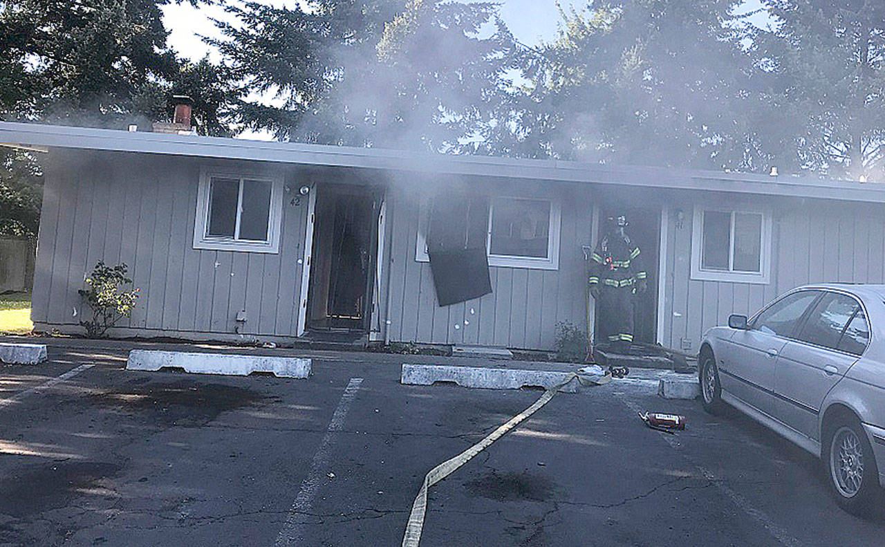 FIrefighters battle a blaze Thursday evening at an apartment complex in the 700 block of Fifth Avenue South. COURTESY PHOTO, Puget Sound RFA