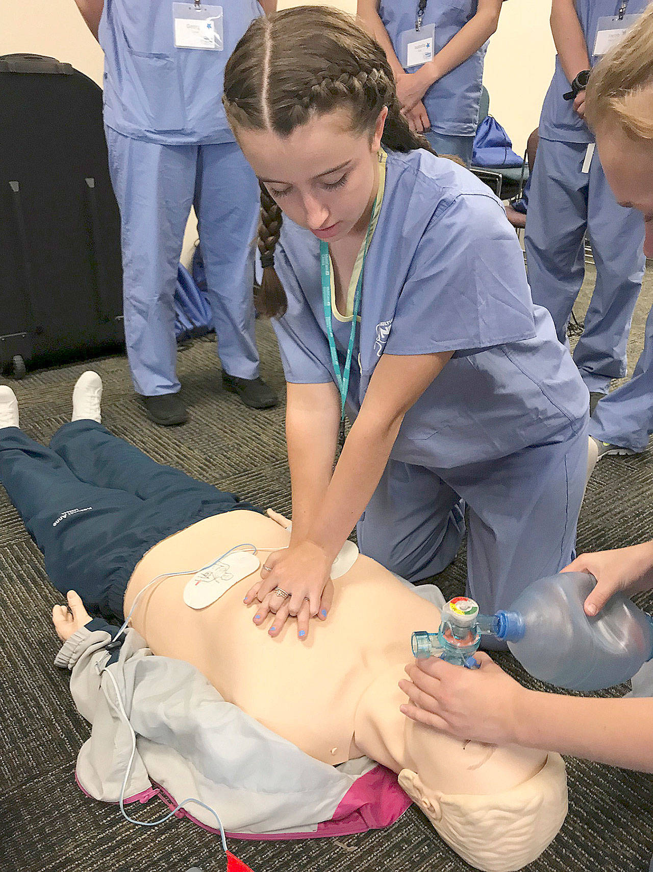 Alyssa Price, a junior-to-be at Kentlake High School, works on reviving a CPR manikin patient during Nurse Camp at Tacoma General Hospital last week. MARK KLAAS, Reporter