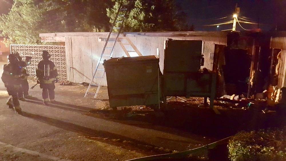 Puget Sound Firefighters put out a fire outside a vacant building early Sunday. The fire did catch the building’s wall, but crews quickly doused it. COURTESY PHOTO, Puget Sound Regional Fire Authority