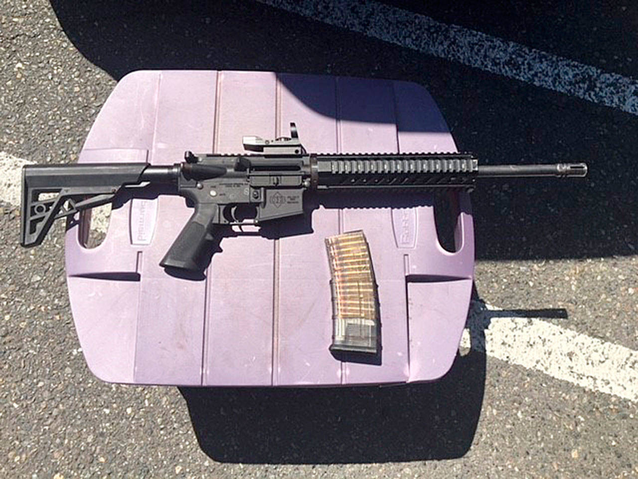 The AR-15 rifle the suspect had in his possession at the time of the shooting at the Kent Station parking garage. Also in the photograph is the loaded magazine that was inserted into the rifle at the time of the shooting. COURTESY PHOTO, King County Sheriff’s Office