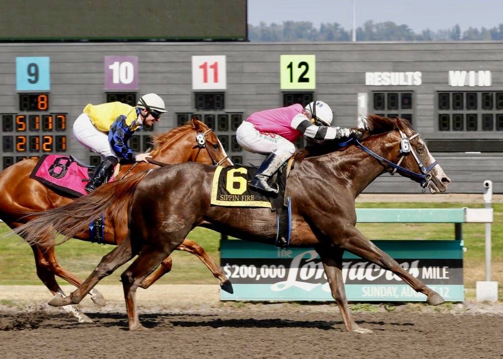 Sippin Fire (No. 6) edges Weekend Wizard in the Muckleshoot Derby at Emerald Downs on Sunday. COURTESY TRACK PHOTO