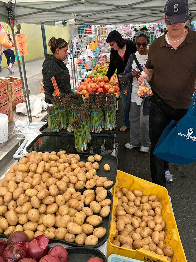 People visit the Kent Farmers Market. FILE PHOTO