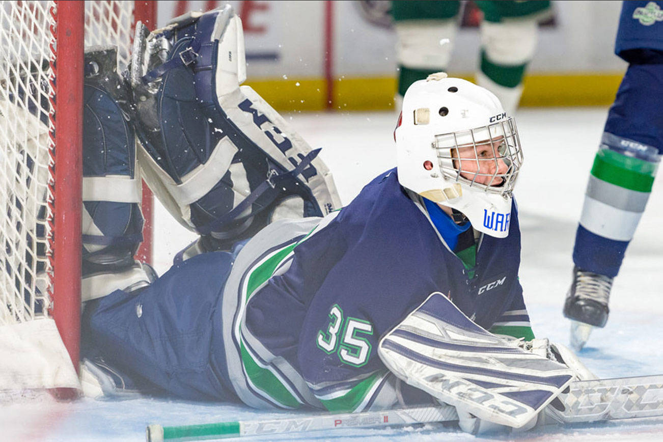 Thunderbirds goalie Eric Ward makes one of his 27 saves against the Silvertips in a Western Hockey League preseason game Tuesday night at the accesso ShoWare Center. COURTESY PHOTO, Brian Liesse, T-Birds