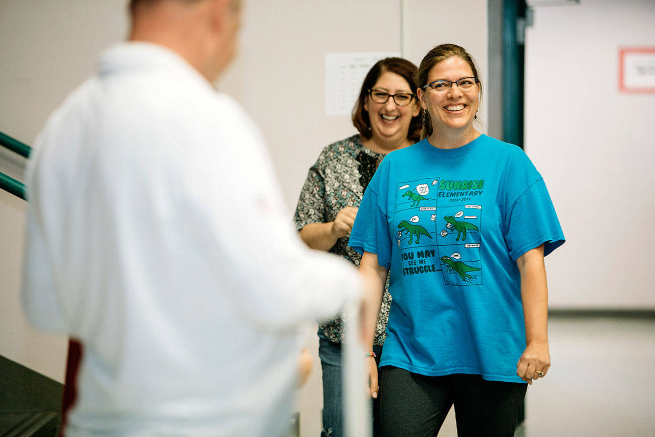 Sunrise Elementary School teacher Tiffany Evenstad is surprised after learning she was chosen a Symetra Hero in the Classroom during a school assembly Sept. 7. COURTESTY PHOTO