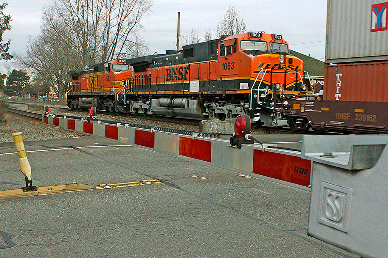 BNSF railroad crossing arms stuck in down position throughout Kent