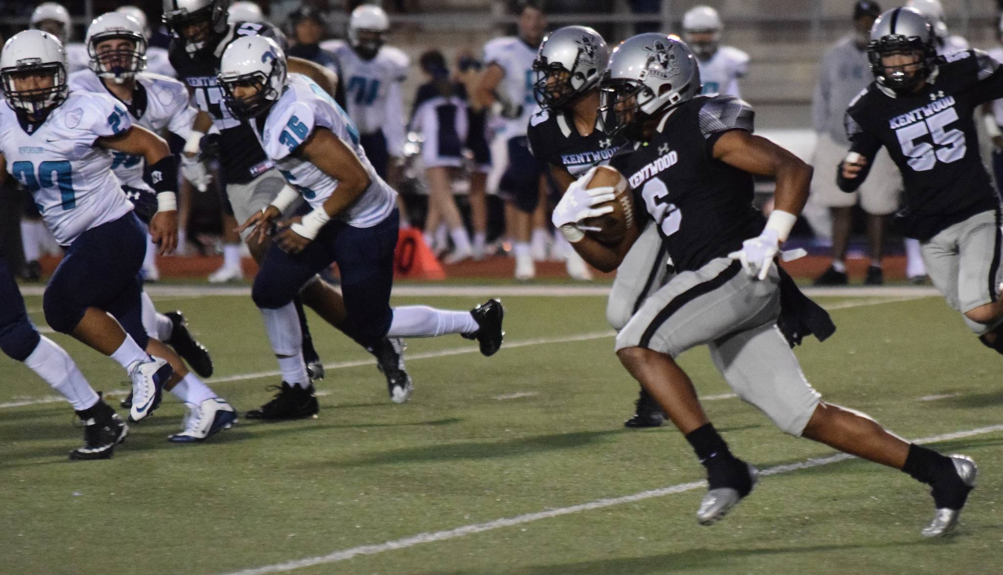 Kentwood’s Dyllon Daniels returns a kickoff 90 yards for a touchdown against Auburn Riverside on Thursday night. RACHEL CIAMPI, Kent Reporter
