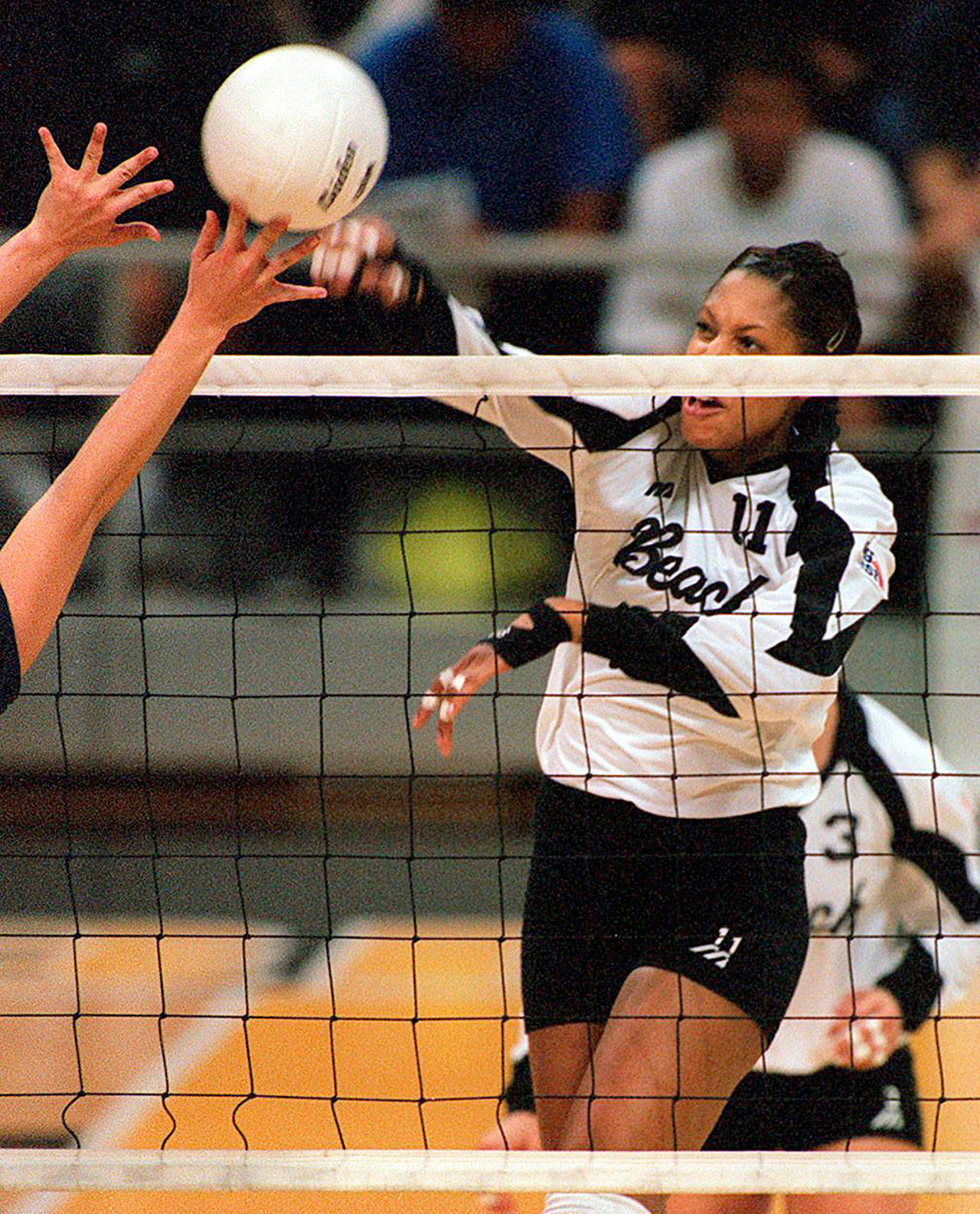 Benishe Dillard-Roberts fires back a shot during her career at Long Beach State. She was the 49ers’ main force, leading the team with 405 kills in 1998 en route to an undefeated season and NCAA championship. COURTESY PHOTO, LBSU Athletics