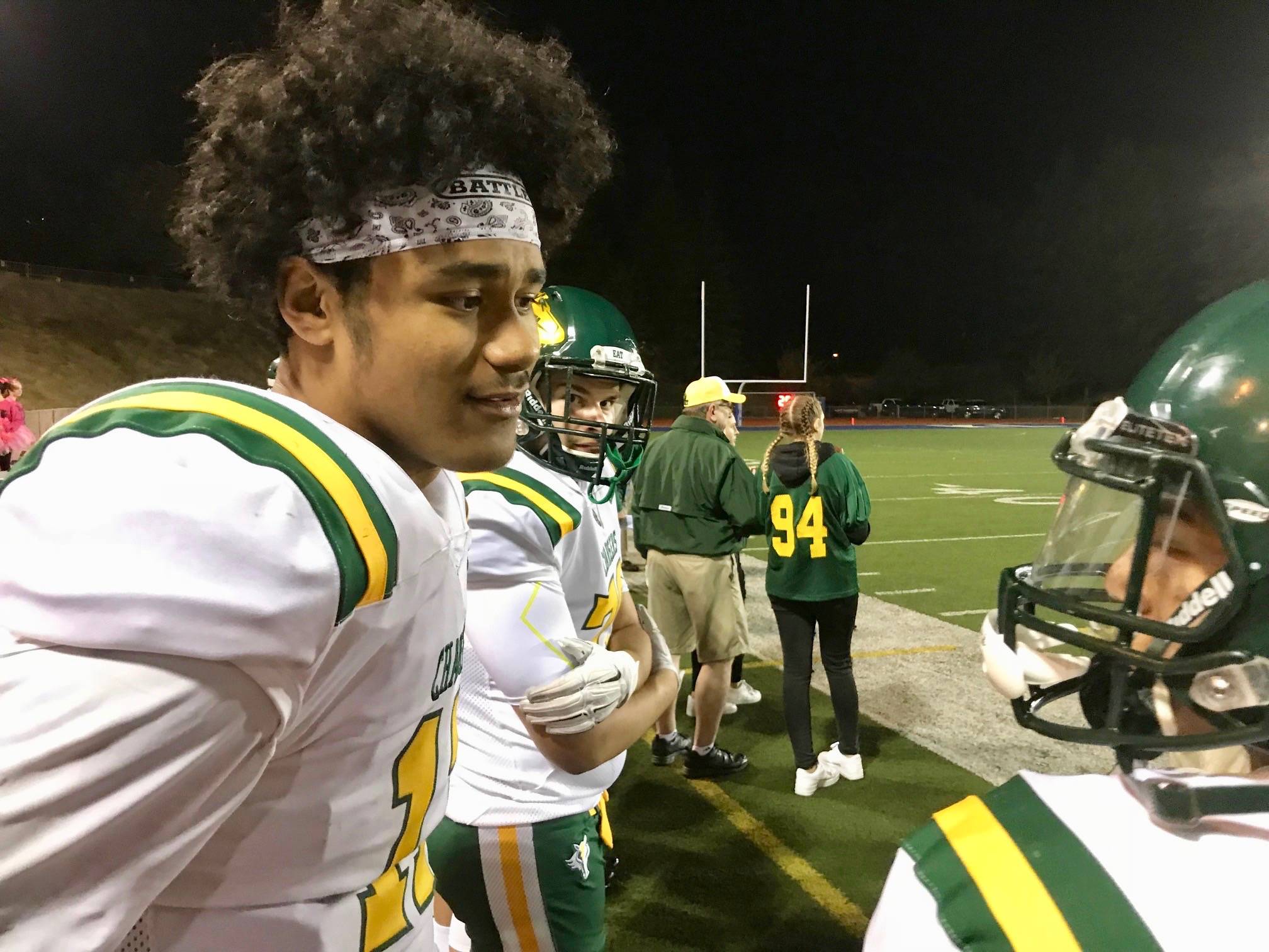 Kentridges Natano Woods talks to a teammate on the sideline late in the second half of Thursday nights NPSL game. Woods accounted for seven touchdowns in the Chargers 71-51 victory against Kent-Meridian. MARK KLAAS, Kent Reporter