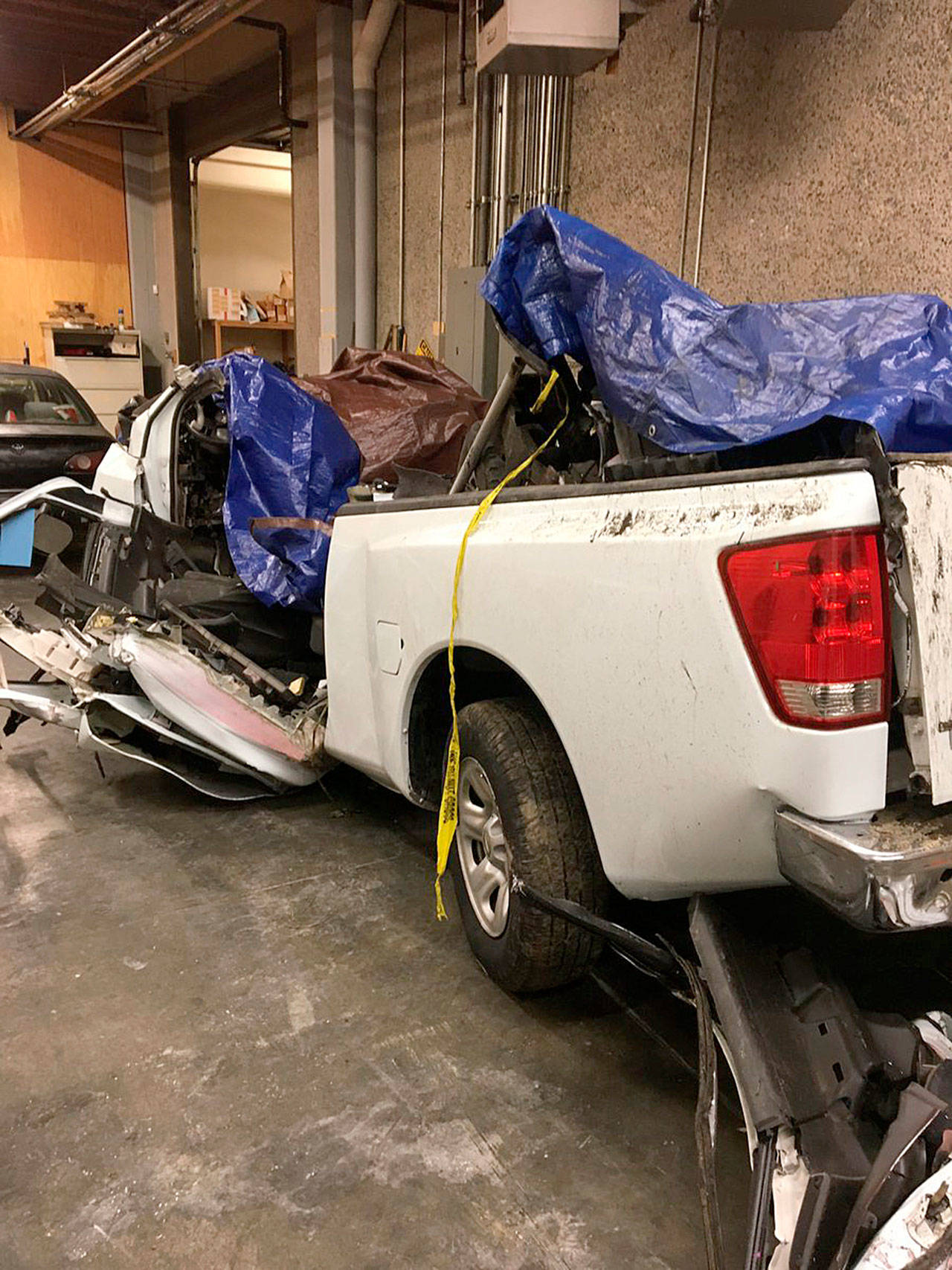 The Washington State Patrol on Tuesday released this photo of the white 2004 Nissan Titan pickup that crashed and killed four Kent men early Sunday along State Route 518. The driver, also of Kent, survived and has been arrested on four counts of vehicular homicide. COURTESY PHOTO, Washington State Patrol