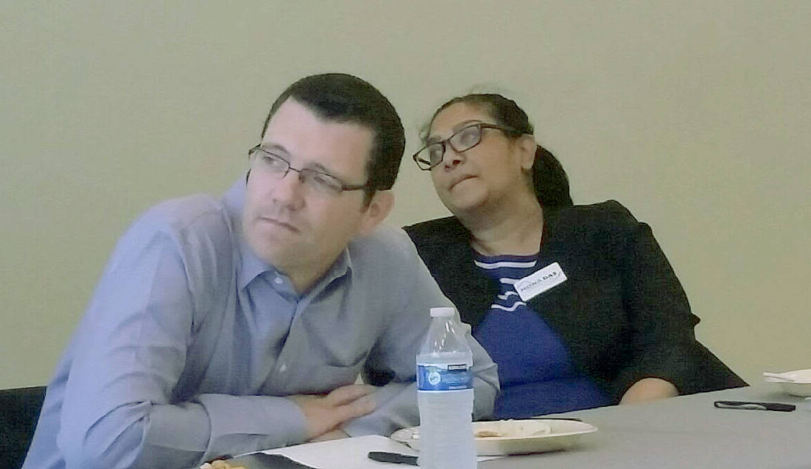 47th Legislative District state Sen. Joe Fain, R-Auburn, and his challenger, Mona Das, D-Covington, listen to other candidates for state office speaking Oct. 16, during a forum at the Auburn Community Event Center. ROBERT WHALE, Auburn Reporter