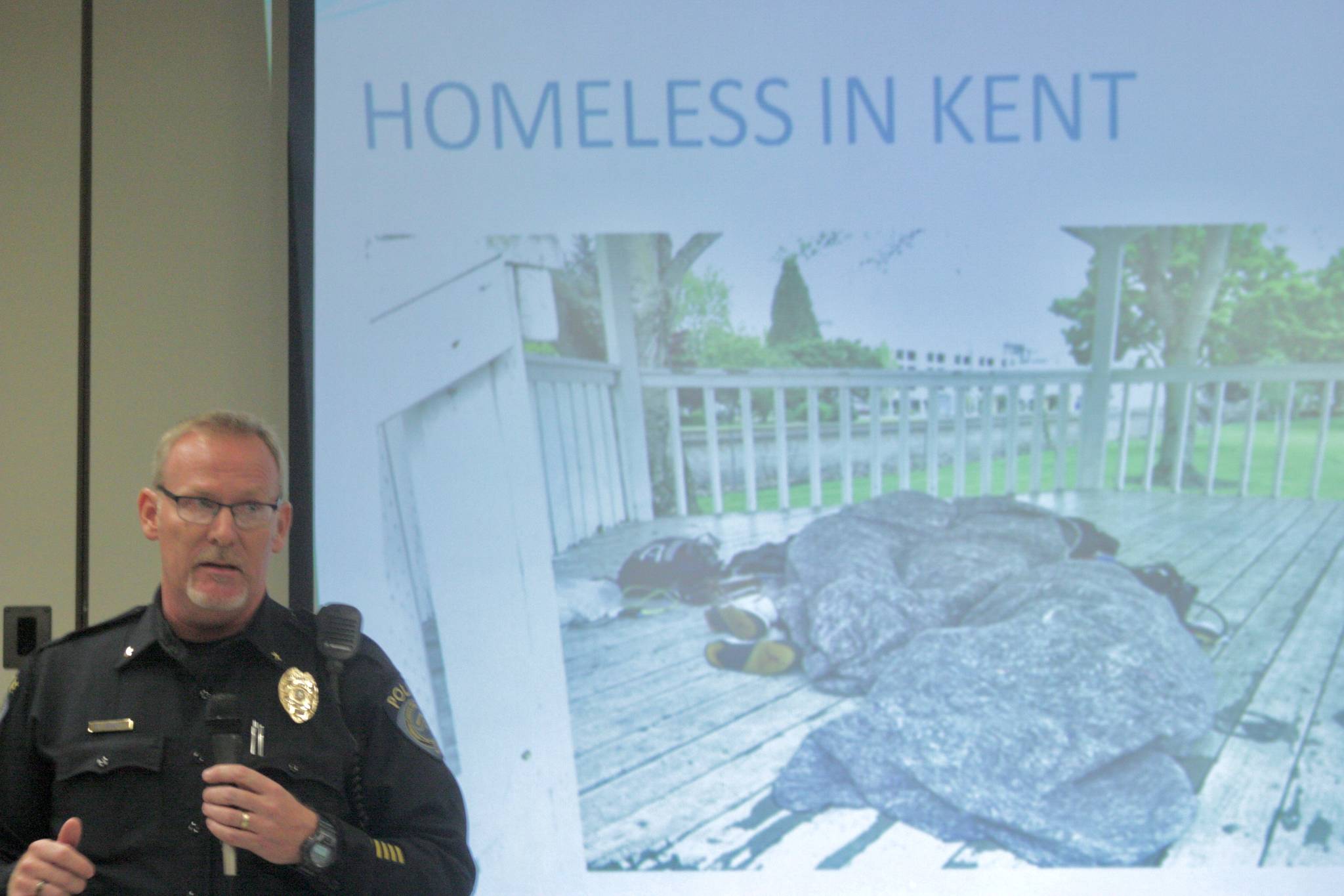 Kent Police Commander Mike O’Reilly, who oversees a special operation unit focused on the homeless, describe the department’s latest efforts in addressing the crisis during a public meeting Oct. 18 at Neely-O’Brien Elementary School. MARK KLAAS, Kent Reporter