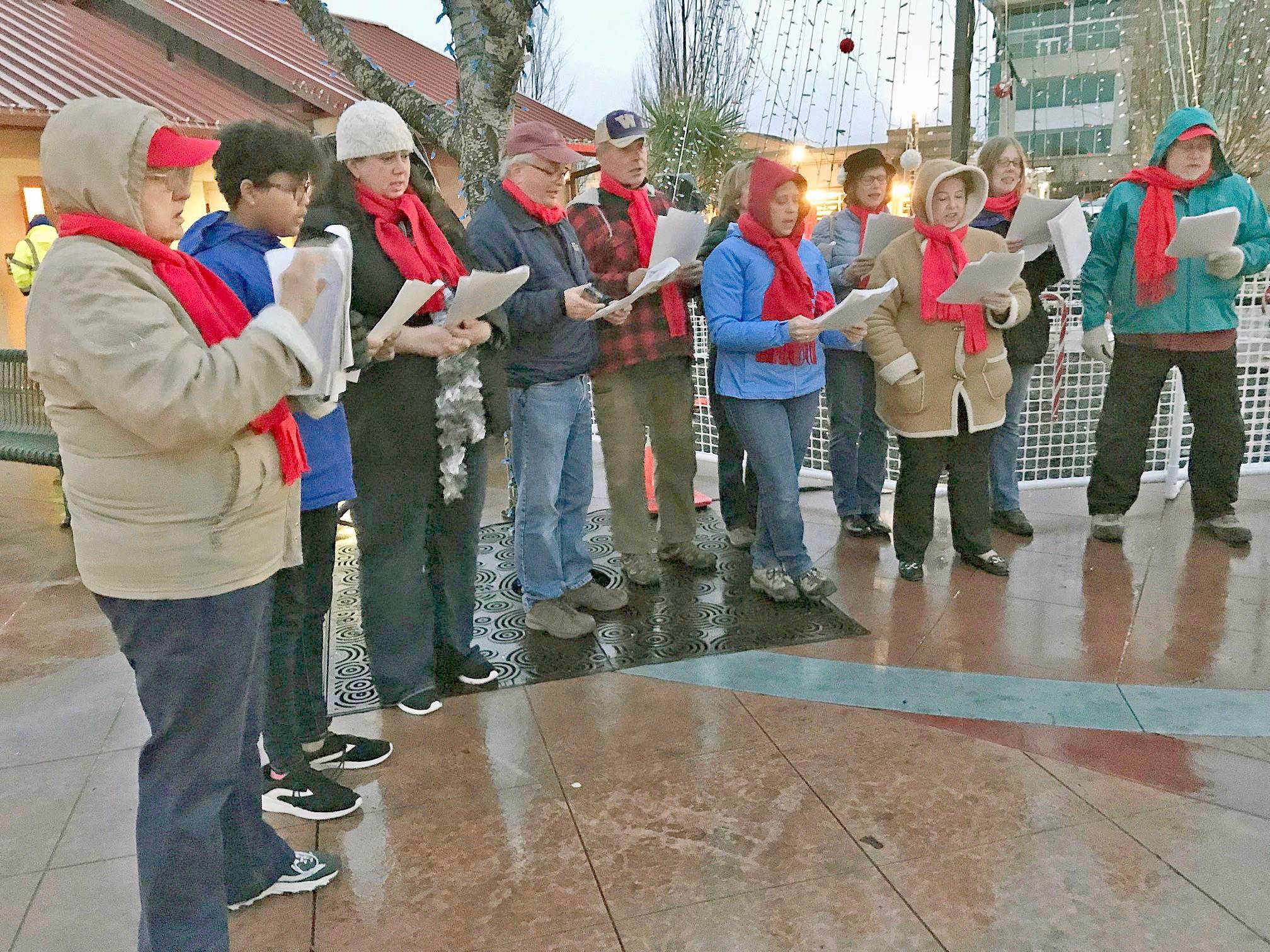 Kent Lutheran Church members sing Christmas carols in the Kent Town Square Plaza during Winterfest last year. The group returns to entertain festival goers this year. MARK KLAAS, Kent Reporter