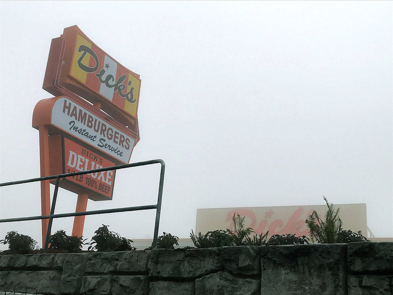 The new Dick’s Drive-In off Pacific Highway South in Kent stands shrouded in the Tuesday morning fog as construction nears full completion before its Dec. 12 grand opening. REPORTER PHOTO