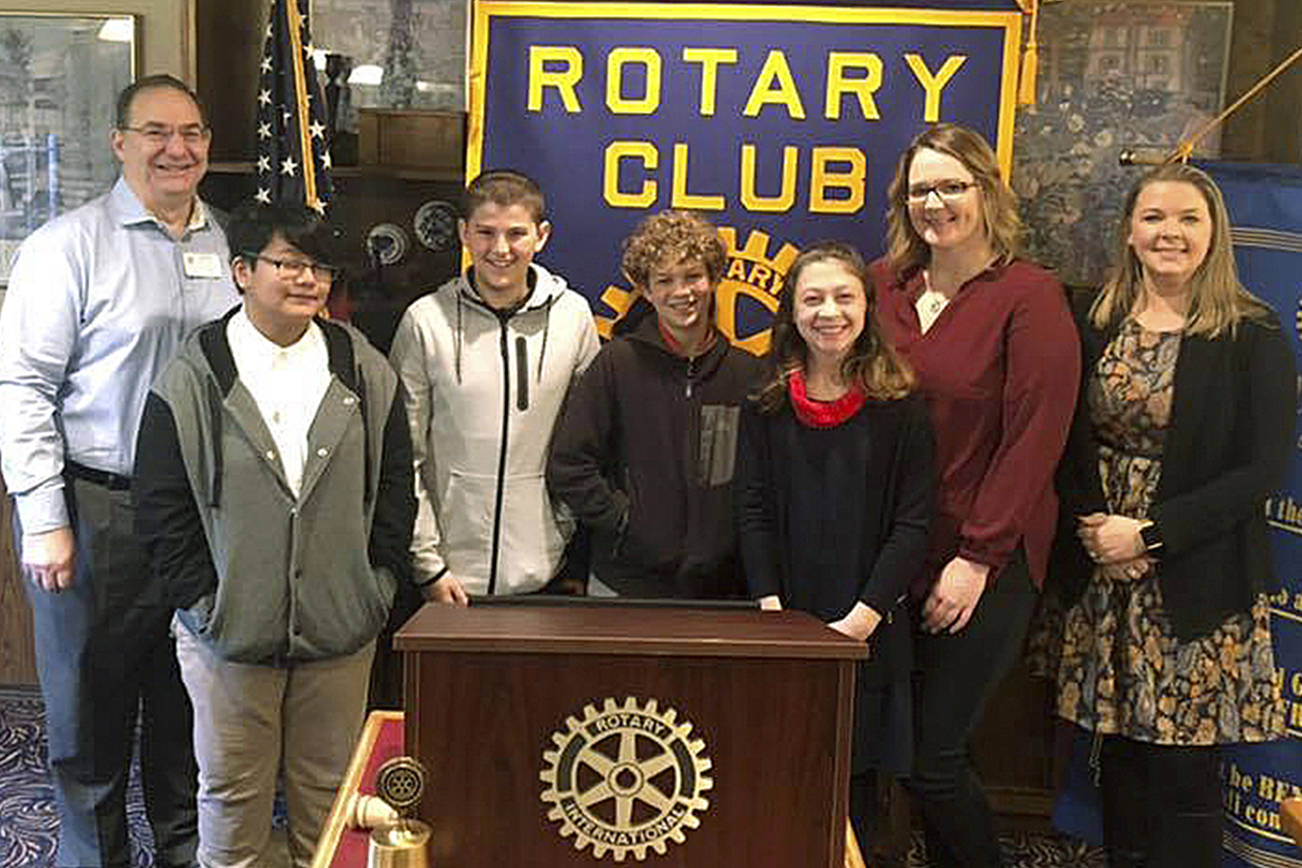 At the Nov. 20 presentation are, from left, Dave Mitchell, Kent Sunrise Rotary member; students Richelle Gust, MacKenzie Pevey, Ethan Loghry and Sophia Soriano, teacher Katrina Baker, and Erica Hanson, Cedar Heights Middle School principal. COURTESY PHOTO