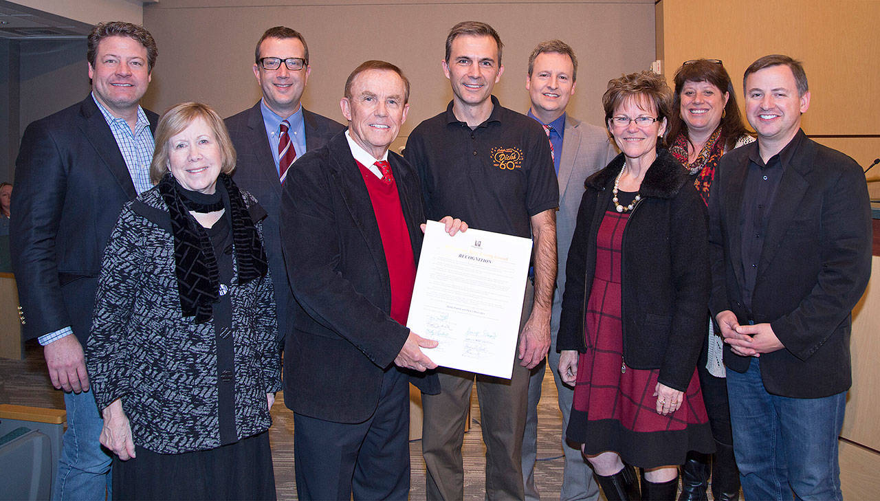 King County Council members join Ron Schmeer (center) of Dick’s Drive-In, from left to right, Reagan Dunn, Jeanne Kohl-Welles, Joe McDermott, Pete von Reichbauer, Schmeer, Dave Upthegrove, Kathy Lambert, Claudia Balducci and Rod Dembowski. The council on Monday recognized Dick’s for its community service. COURTESY PHOTO, King County Council