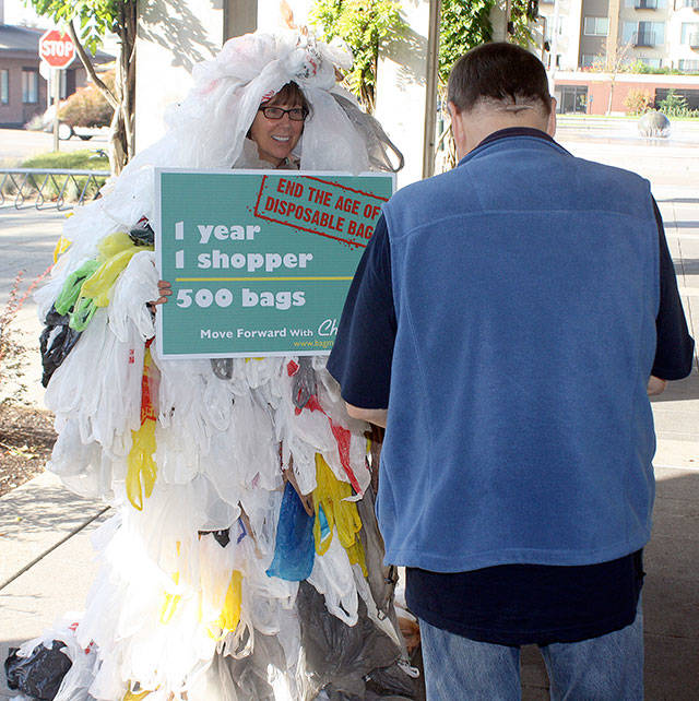 The Bag Monster, aka Abbe Gloor, appeared in 2015 outside the Kent Library to promote a plastic bag ban. FILE PHOTO