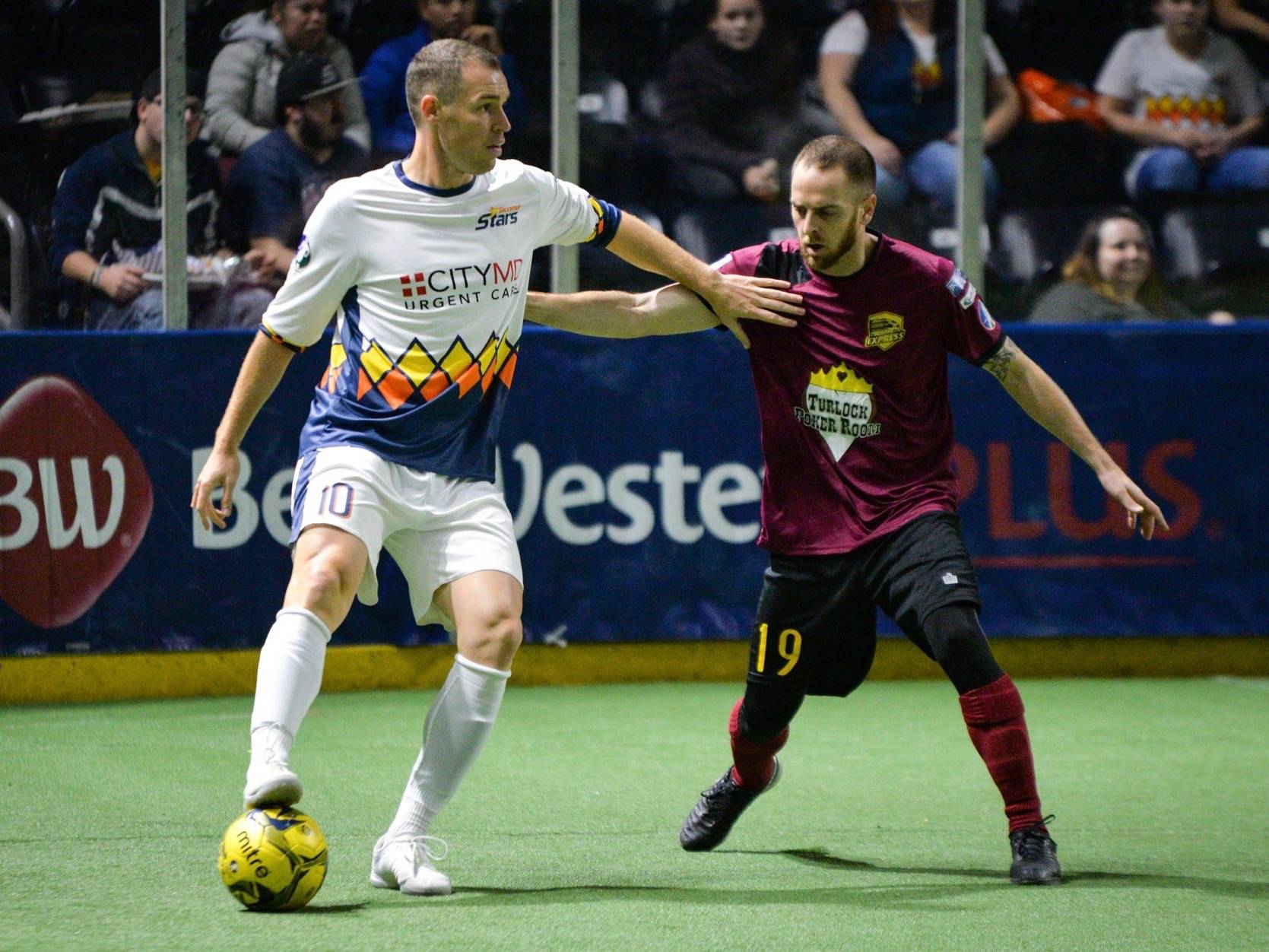 The Stars’ Nick Perera, left, looks to advance the ball against the Express’ Matthew Germain during MASL play Dec. 1. Perera is now taking on the role as head coach for the club. COURTESY PHOTO, Stars
