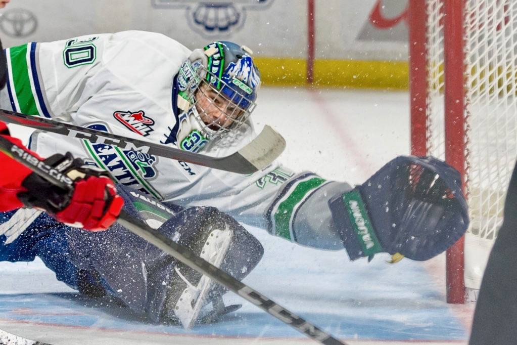 Thunderbirds goalie Liam Hughes reaches to make one of his 30 saves against the Cougars on Friday night. COURTESY PHOTO, Brian Liesse, T-Birds